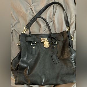 Michael Kors classic black leather large tote with gold chain and charm